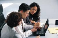 Business people around a computer