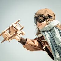 Young child with model airplane