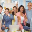 Image of employees giving a "thumbs up"