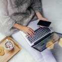 Image of woman relaxing while on laptop